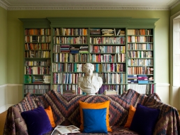 Classical Georgian green paint highlights a library of well thumbed books, whilst a cast of Admiral Nelson takes centre stage.