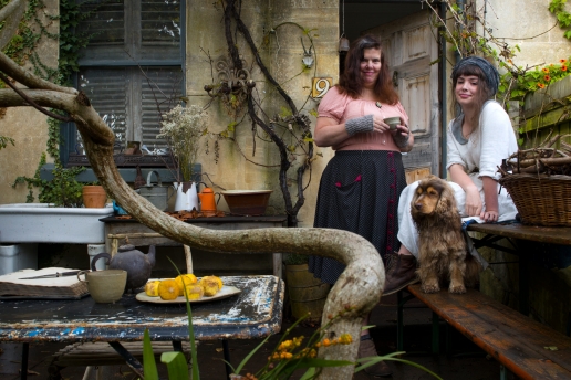 Jude Wisdom, her daughter Flory and Hector the cocker spaniel in their garden at home.